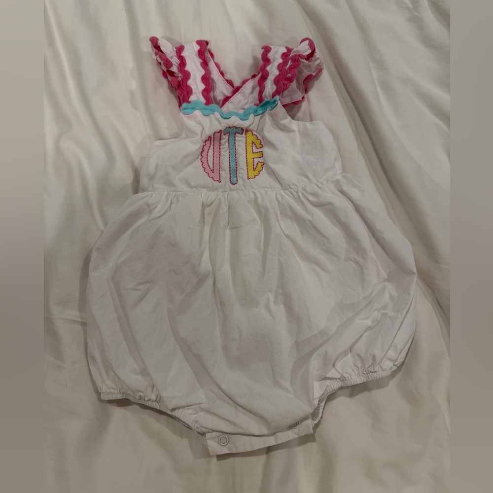 White Baby Romper with Pink and Blue Accents